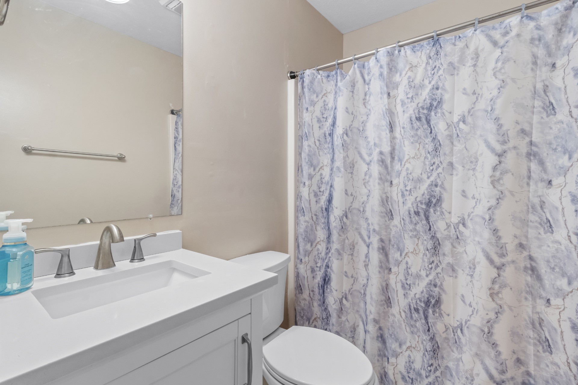 586 Foxfield Road Hopkinsville, KY 42240 - Photo 26 of 30 a bathroom with a toilet a sink and a mirror
