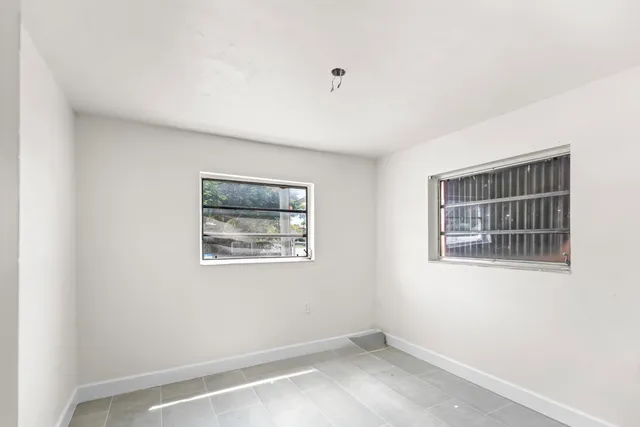 a view of a hallway with closet and entryway