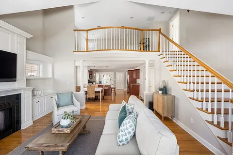 a living room with furniture fireplace and flat screen tv