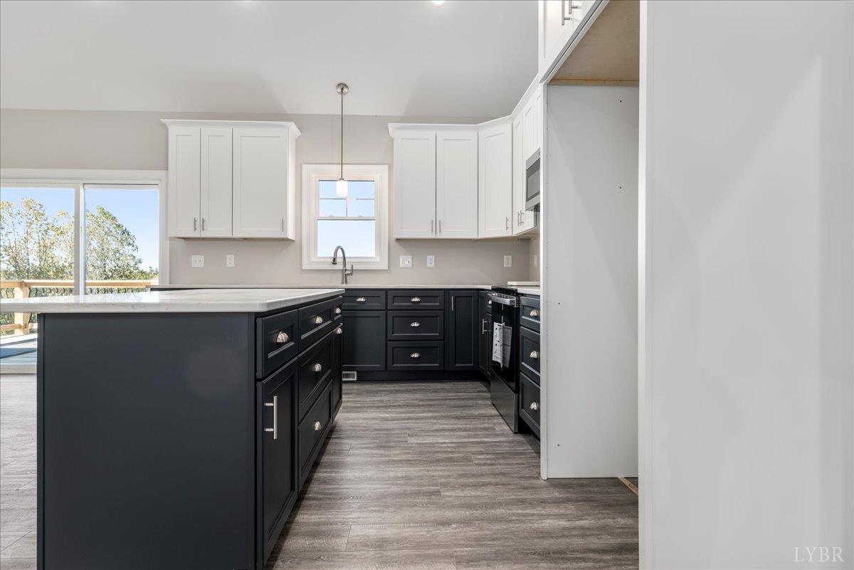 9830 Leesville Road Evington, VA 24550 - Photo 11 of 33 a kitchen with stainless steel appliances granite countertop a sink a stove and cabinets
