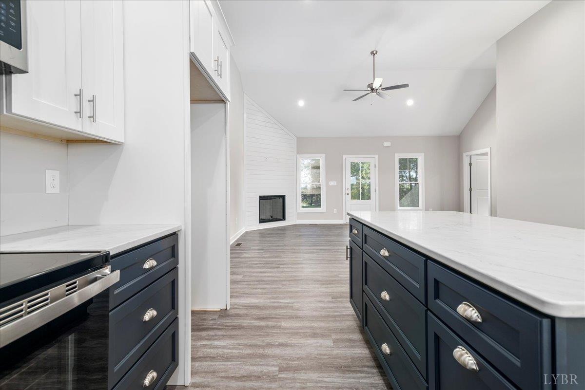 9830 Leesville Road Evington, VA 24550 - Photo 13 of 33 a kitchen with stainless steel appliances granite countertop a stove and a sink