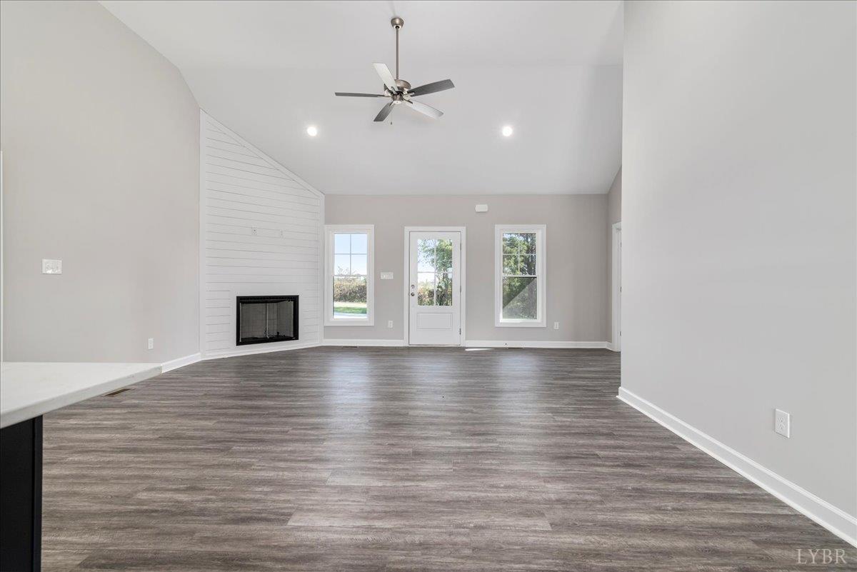 9830 Leesville Road Evington, VA 24550 - Photo 14 of 33 a view of an empty room with window and wooden floor
