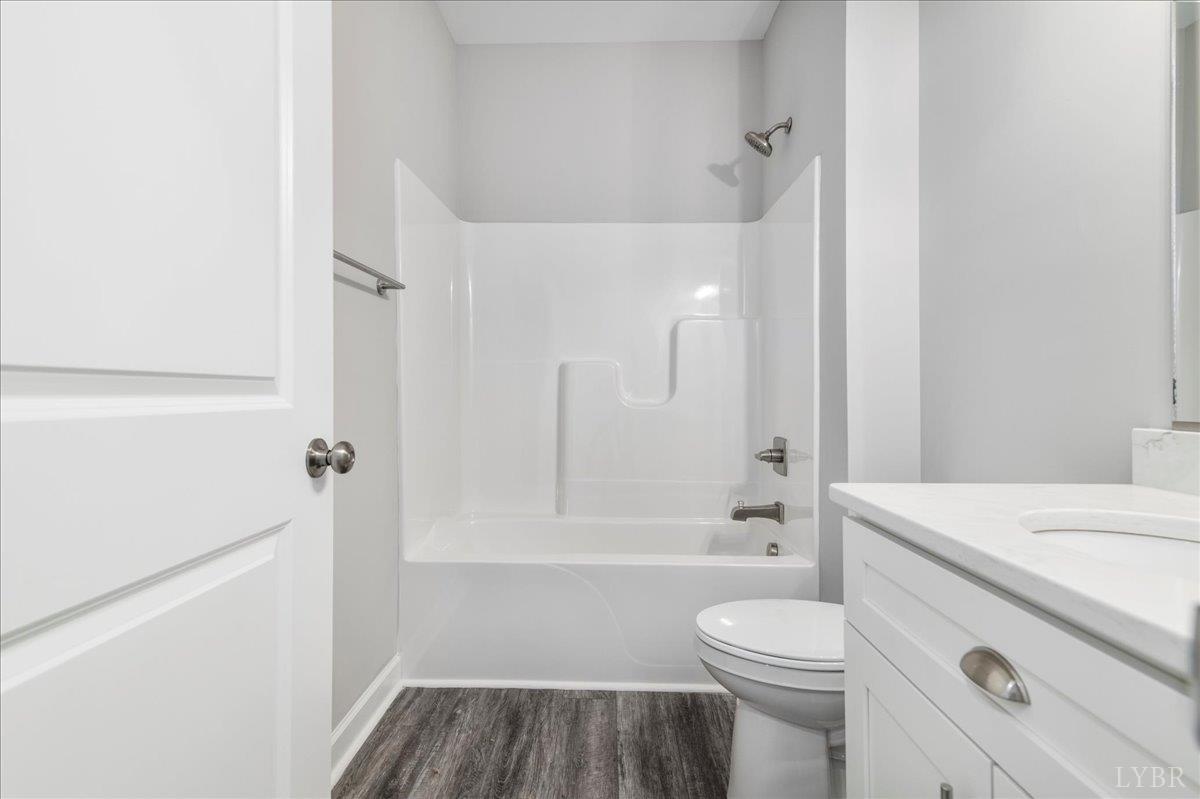 9830 Leesville Road Evington, VA 24550 - Photo 16 of 33 a bathroom with a sink toilet vanity and shower