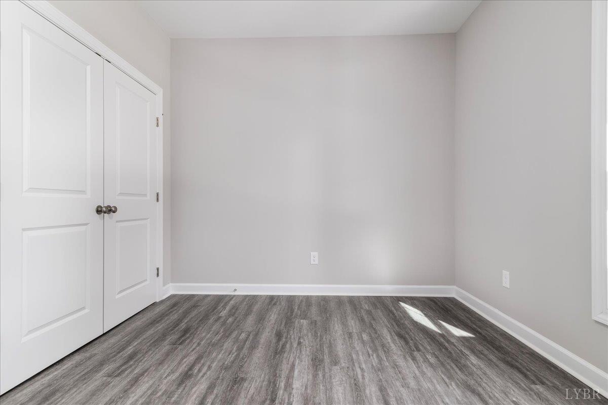 9830 Leesville Road Evington, VA 24550 - Photo 18 of 33 a view of an empty room and wooden floor