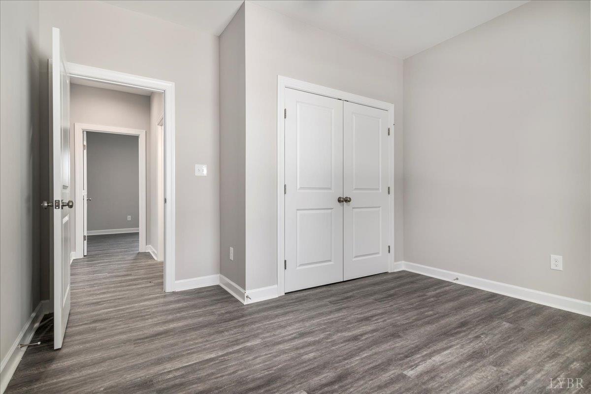 9830 Leesville Road Evington, VA 24550 - Photo 19 of 33 a view of a hallway with wooden floor