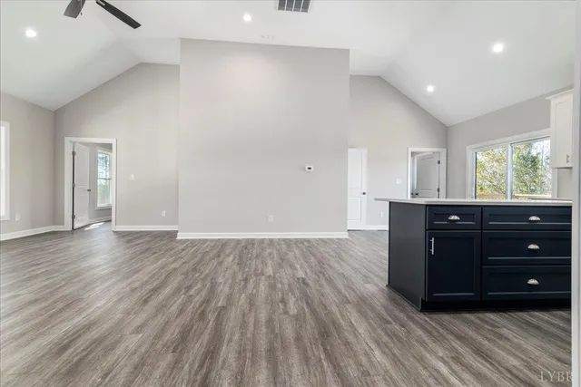 a room with a dresser and a window