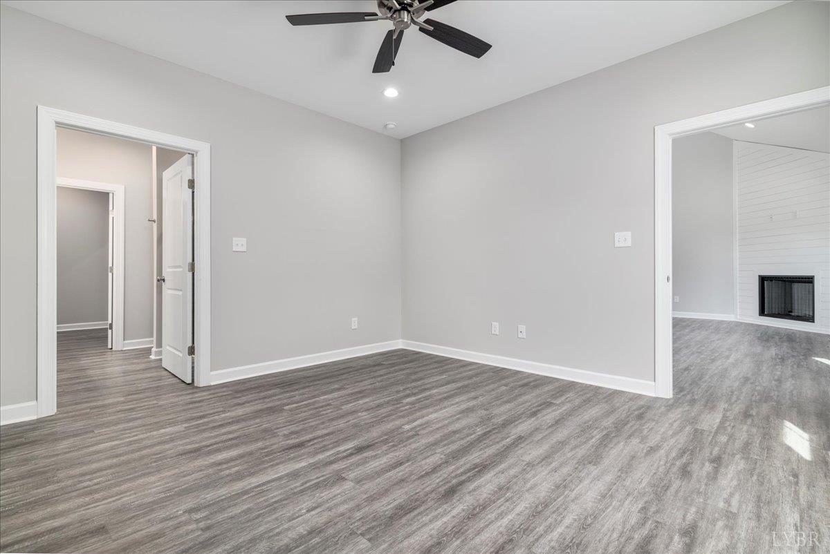 9830 Leesville Road Evington, VA 24550 - Photo 26 of 33 wooden floor in an empty room with a window