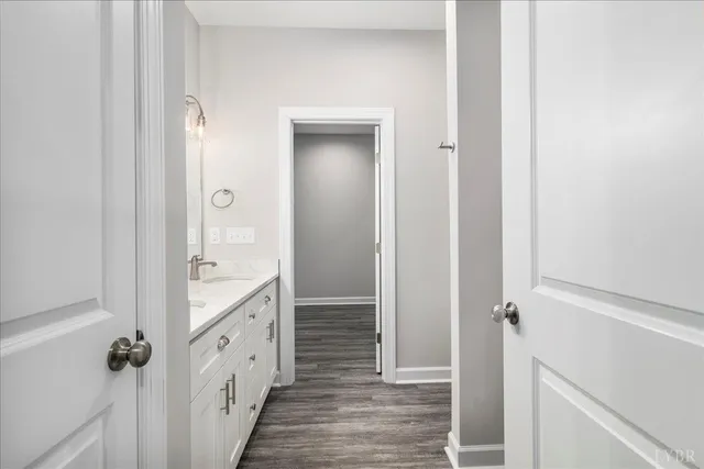 a bathroom with a double vanity sink and mirror