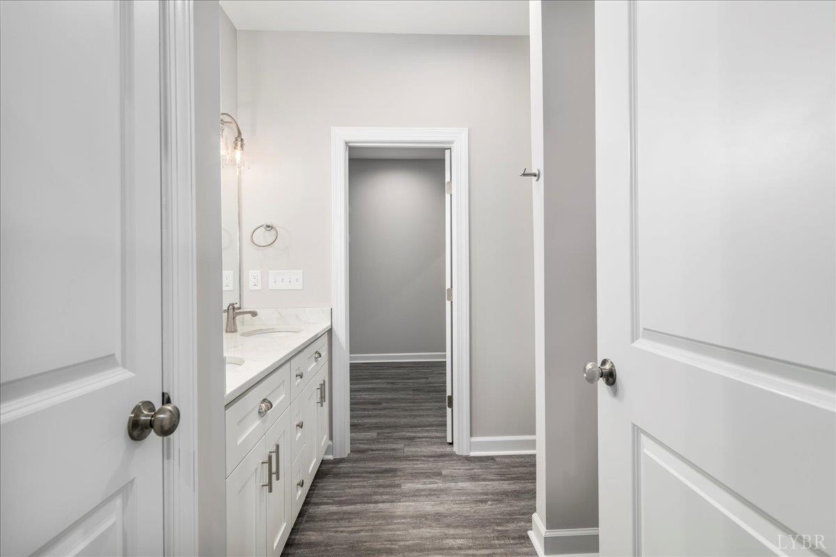 9830 Leesville Road Evington, VA 24550 - Photo 27 of 33 a bathroom with a double vanity sink and mirror