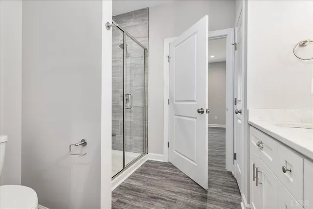 a bathroom with a shower and a toilet