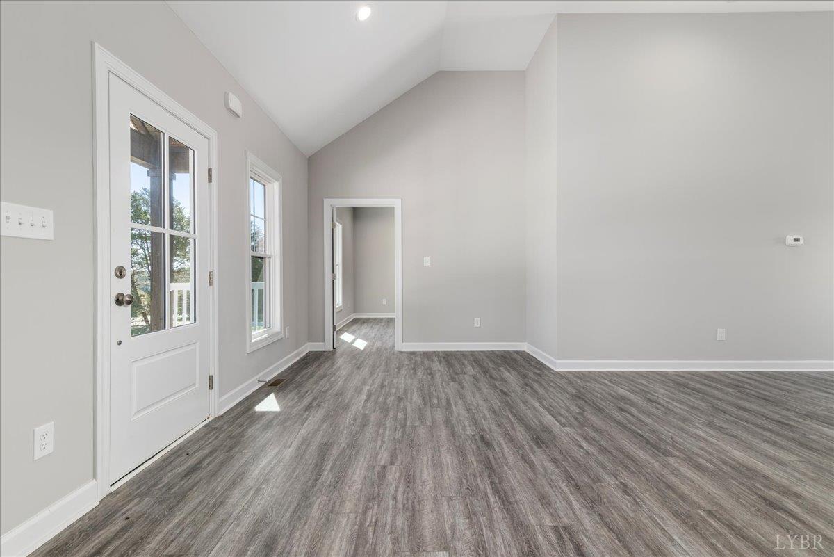 9830 Leesville Road Evington, VA 24550 - Photo 9 of 33 wooden floor in an empty room with a window