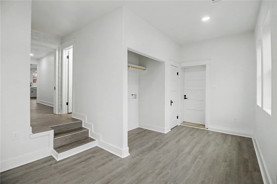 902 Post Oak Street Hearne, TX 77859 - Photo 21 of 26 wooden floor in an empty room with a window