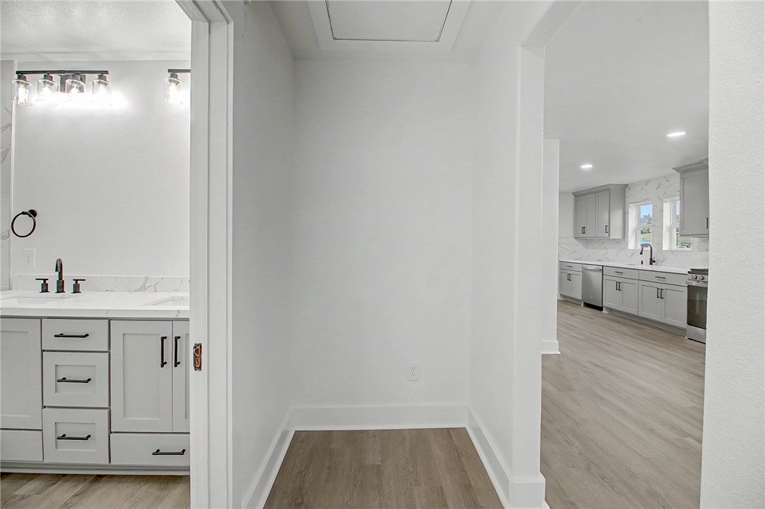 902 Post Oak Street Hearne, TX 77859 - Photo 6 of 26 a view of a kitchen from the hallway