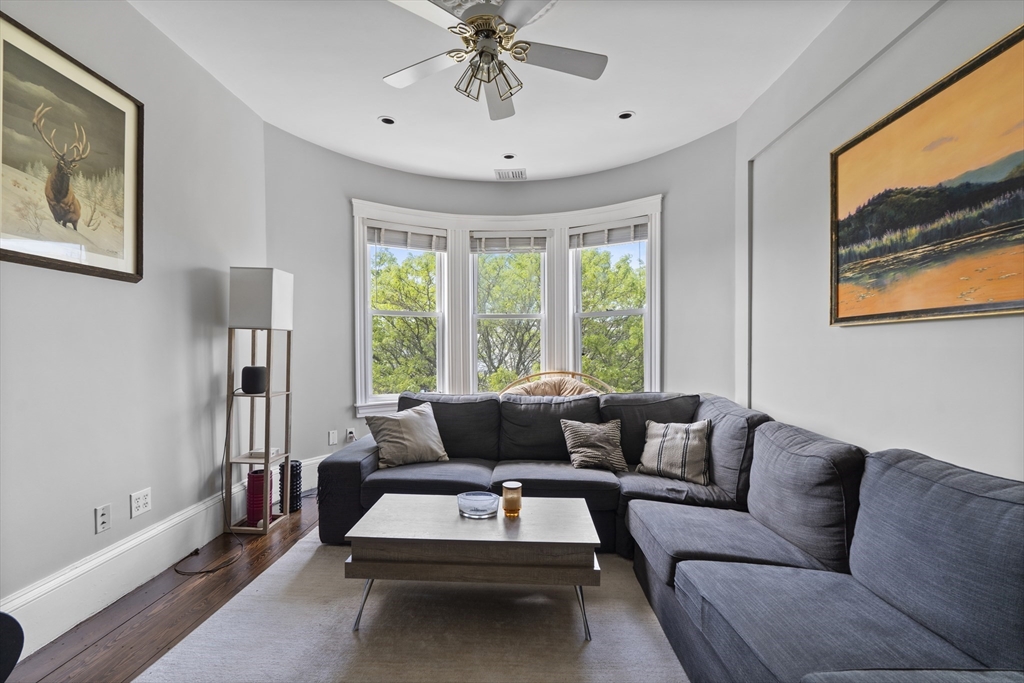 194 Emerson Street Boston, MA 02127 - Photo 2 of 18 a living room with furniture and a large window