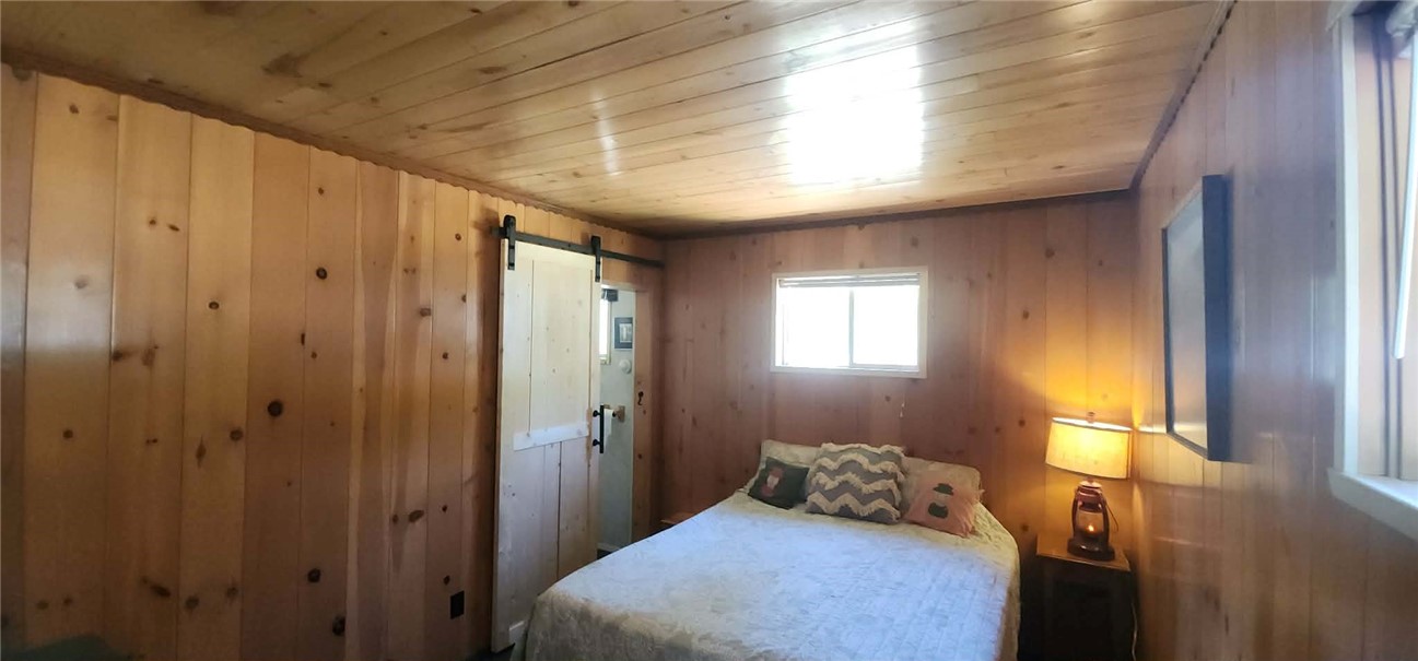 7515 Abner Lane Forest Ranch, CA 95942 - Photo 12 of 65 a bedroom with a bed and a window