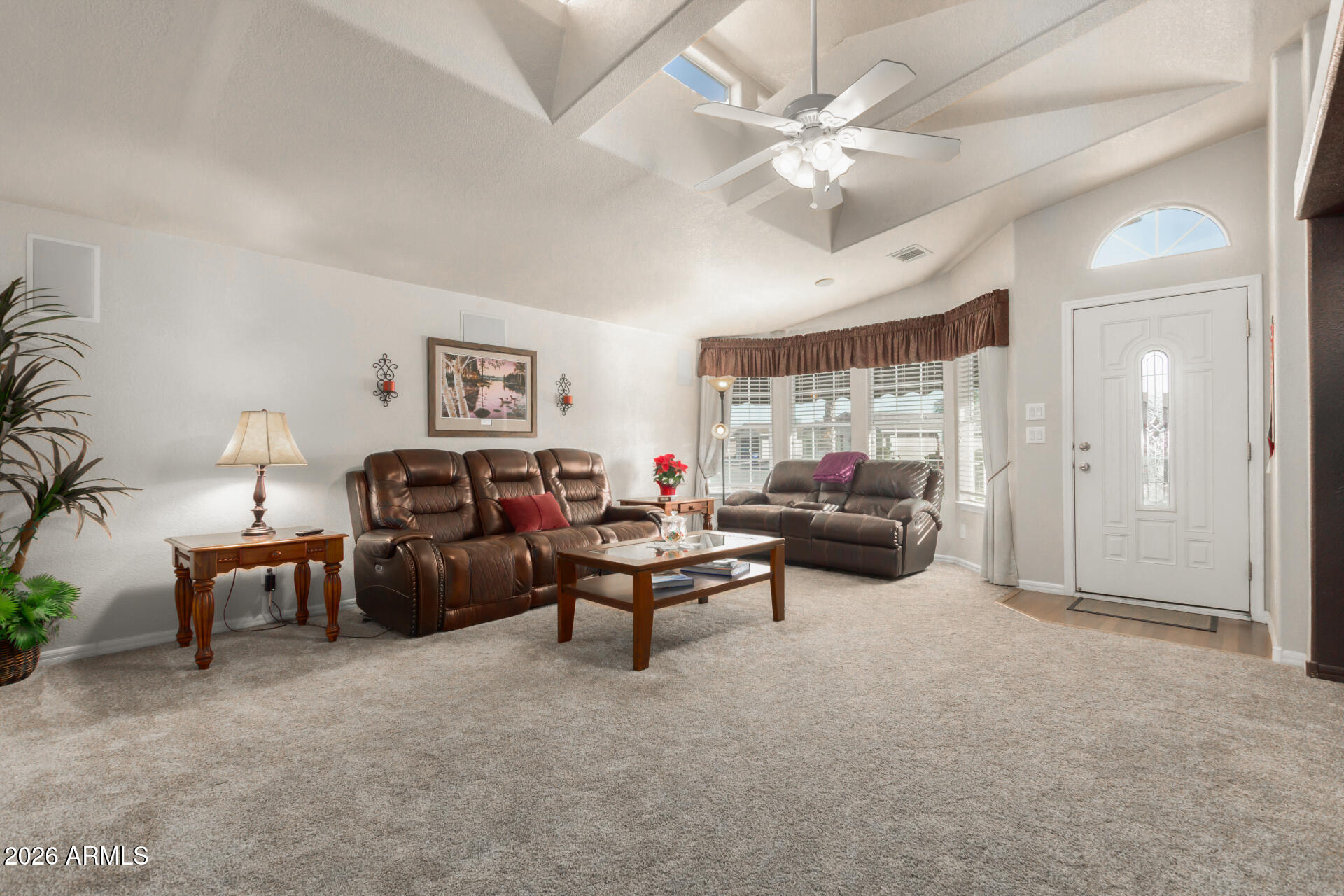 3301 South Goldfield Road, Unit 4086 Apache Junction, AZ 85119 - Photo 18 of 42 a living room with furniture and a chandelier