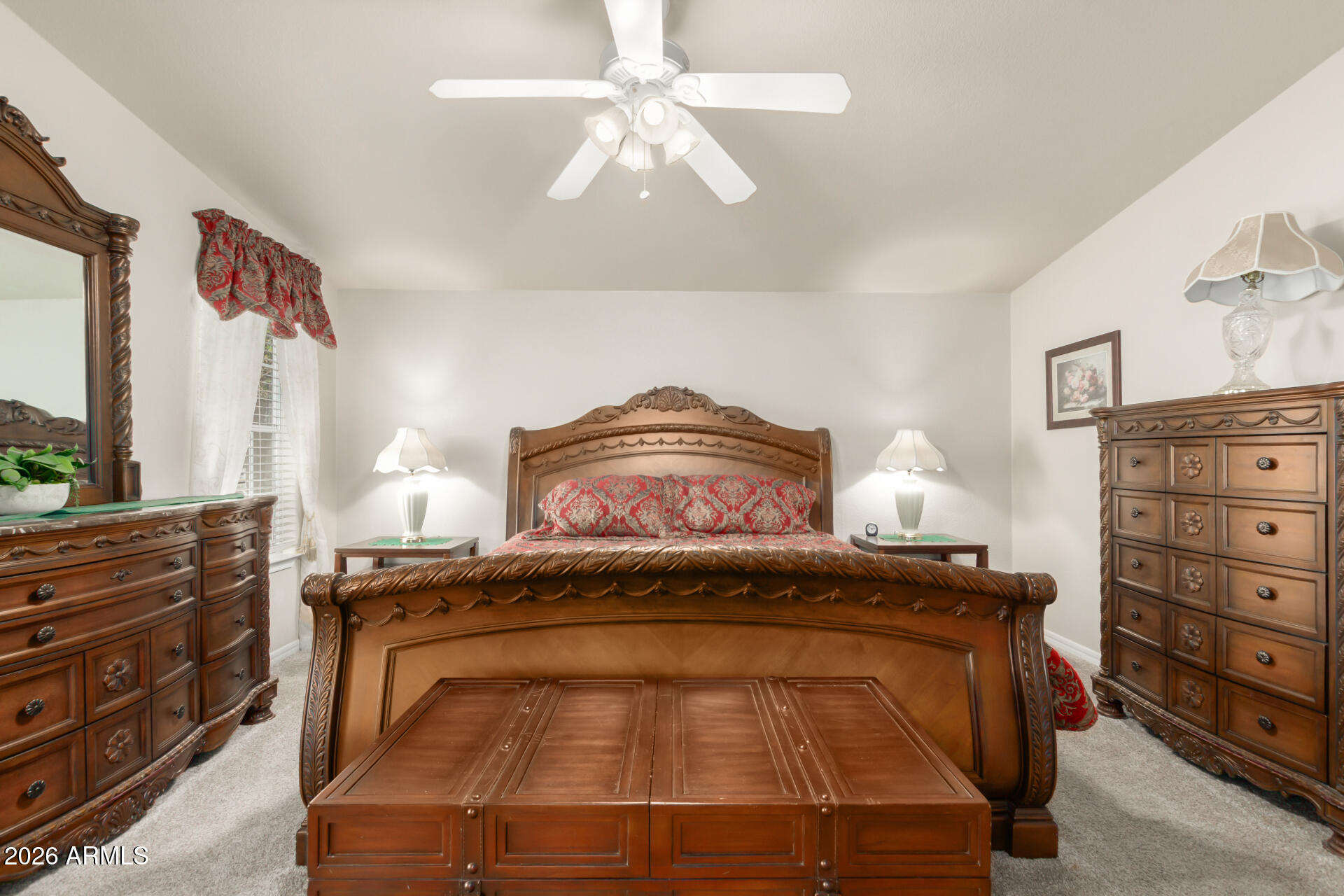 3301 South Goldfield Road, Unit 4086 Apache Junction, AZ 85119 - Photo 27 of 42 a bedroom with a bed and a cabinets