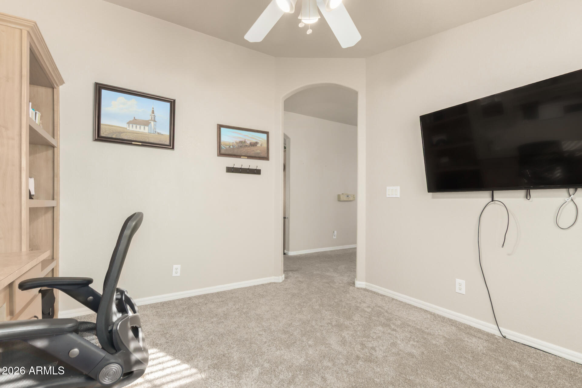3301 South Goldfield Road, Unit 4086 Apache Junction, AZ 85119 - Photo 33 of 42 a view of a livingroom with furniture and a flat screen tv