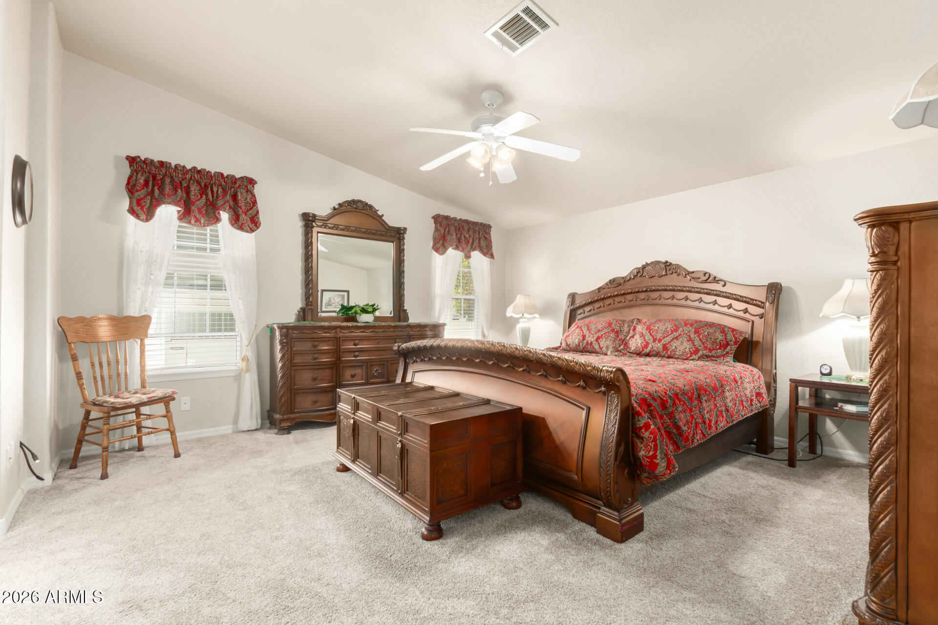 3301 South Goldfield Road, Unit 4086 Apache Junction, AZ 85119 - Photo 7 of 42 a bedroom with a bed chair and wall painting