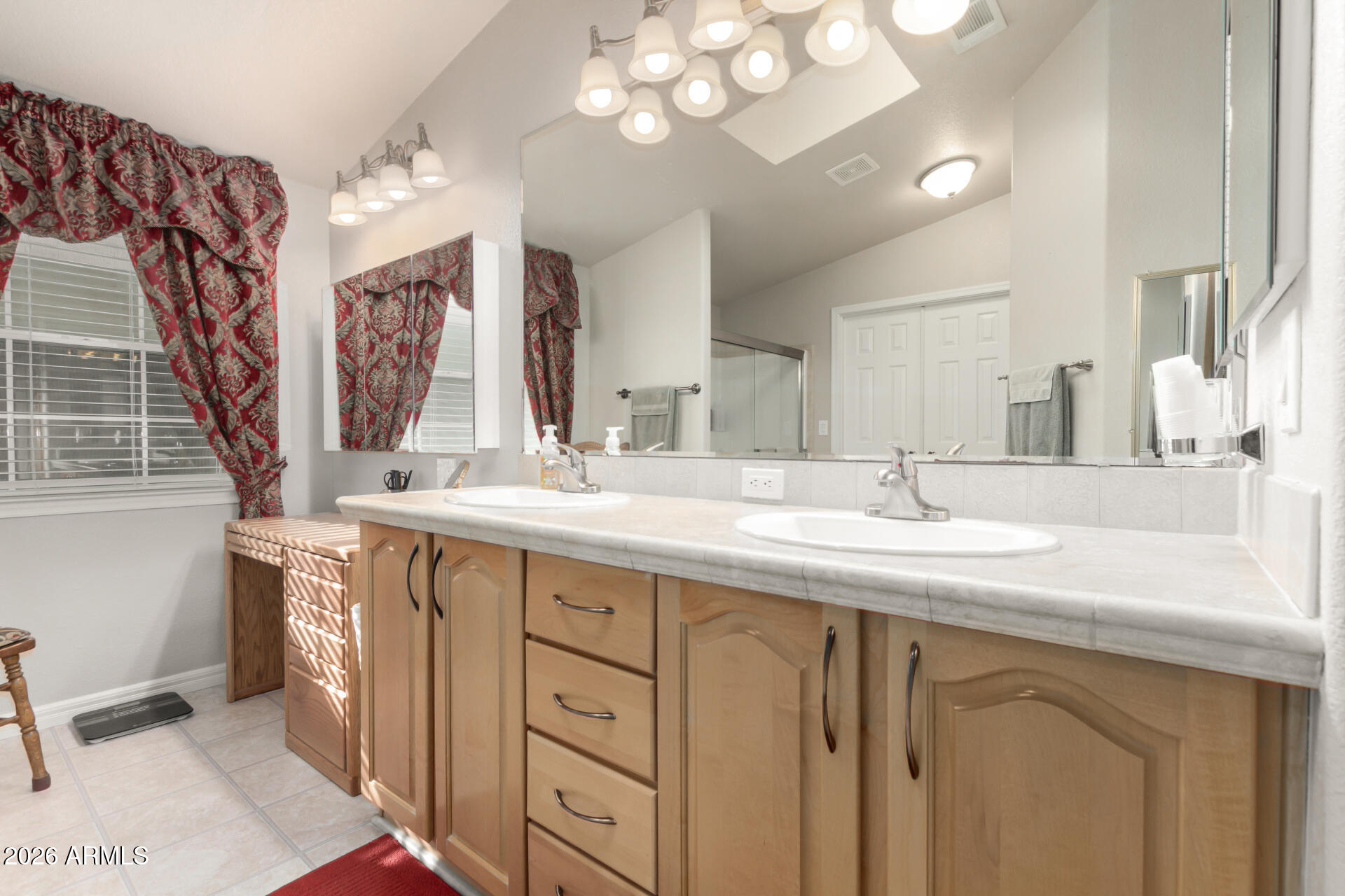 3301 South Goldfield Road, Unit 4086 Apache Junction, AZ 85119 - Photo 8 of 42 a bathroom with a sink vanity and a mirror