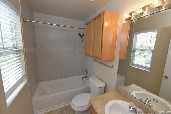 a bathroom with a toilet a sink and a bathtub