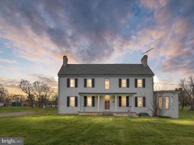 a large building with a yard in front of it