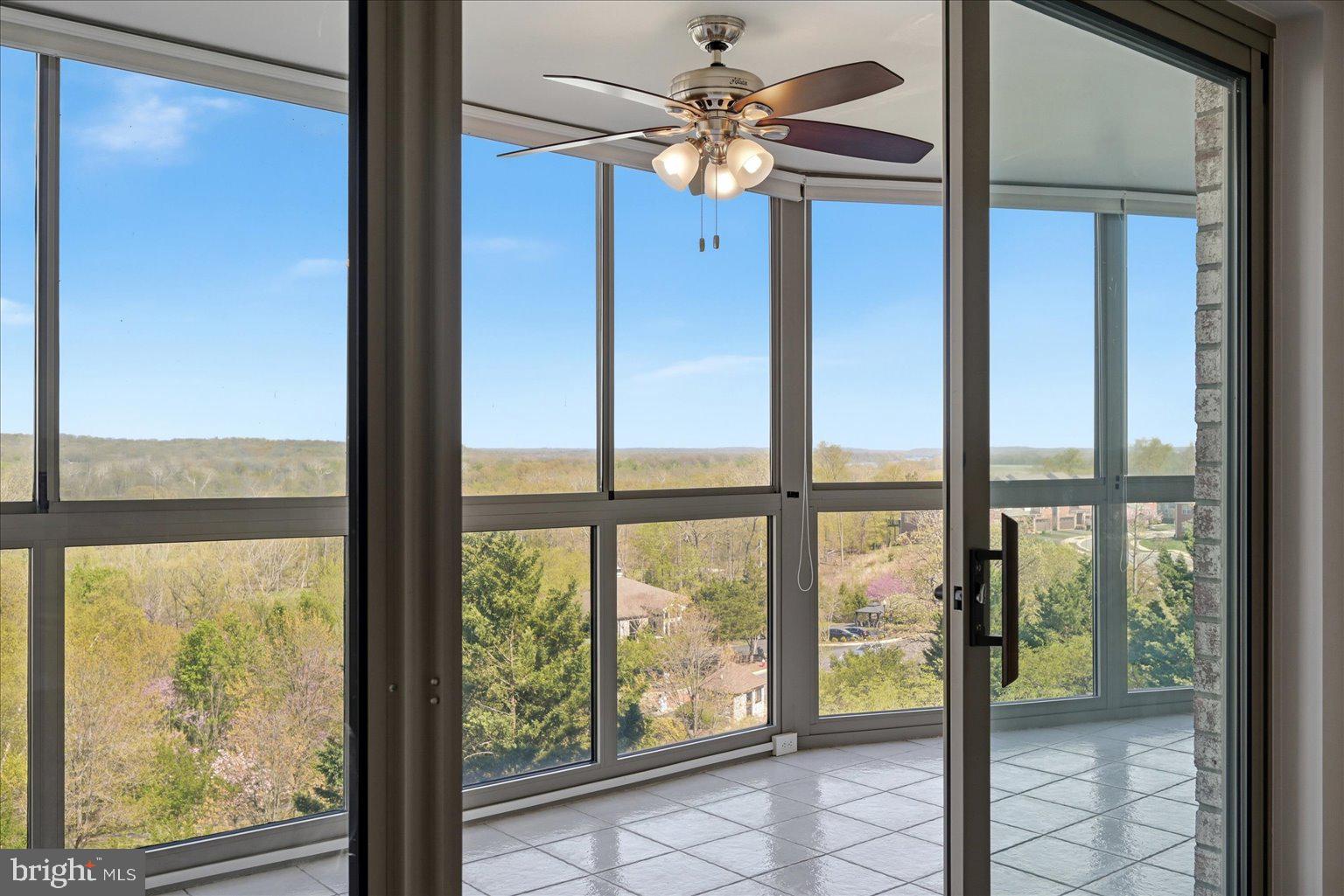 19385 Cypress Ridge Terrace, Unit 514 Leesburg, VA 20176 - Photo 31 of 81 Large sunroom with view of the Potomac River