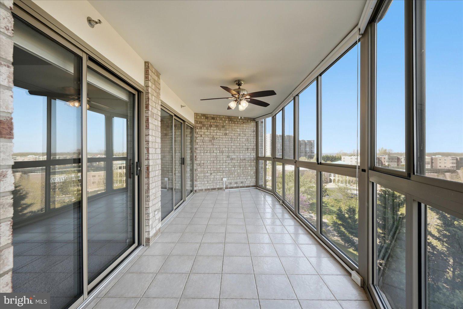 19385 Cypress Ridge Terrace, Unit 514 Leesburg, VA 20176 - Photo 32 of 81 Large Sunroom with updated ceramic flooring