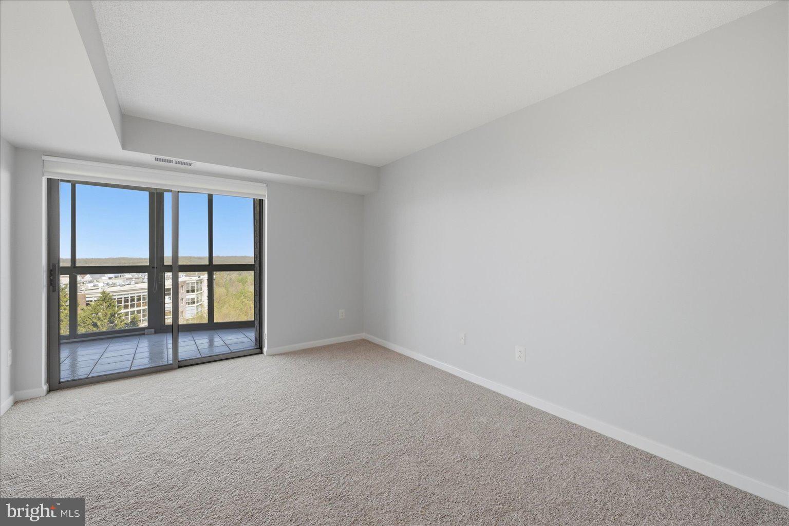 19385 Cypress Ridge Terrace, Unit 514 Leesburg, VA 20176 - Photo 42 of 81 Bedroom #2 new carpet, sunroom access