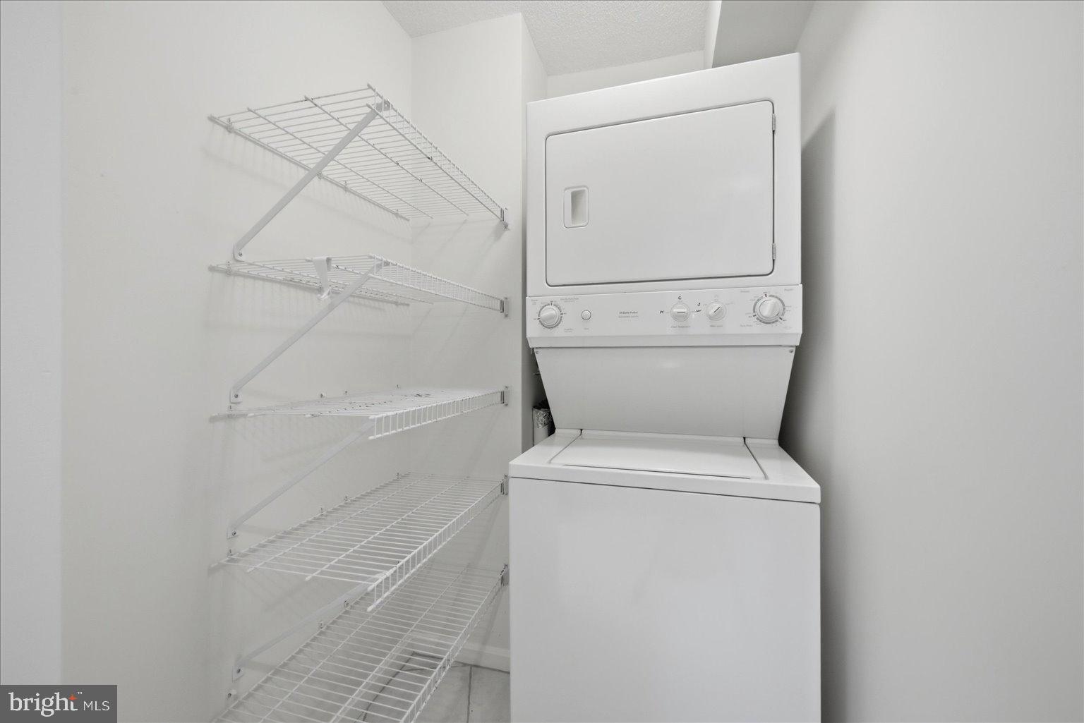 19385 Cypress Ridge Terrace, Unit 514 Leesburg, VA 20176 - Photo 46 of 81 In Unit Washer and Dryer with Storage Shelves