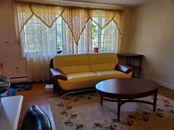 a living room with a couch and a table