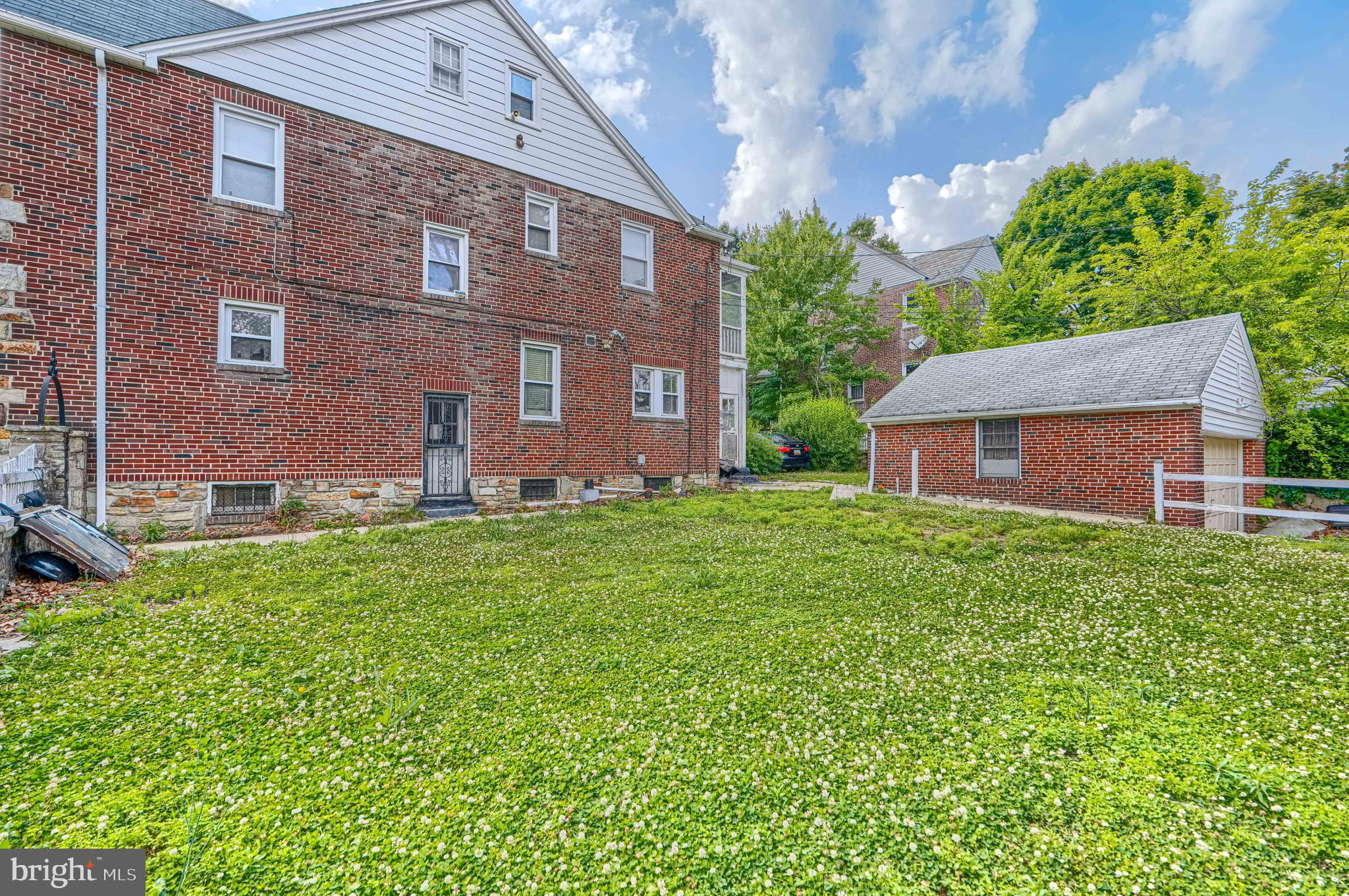 3212 Dorchester Road Baltimore, MD 21215 - Photo 7 of 45 a front view of a house with garden