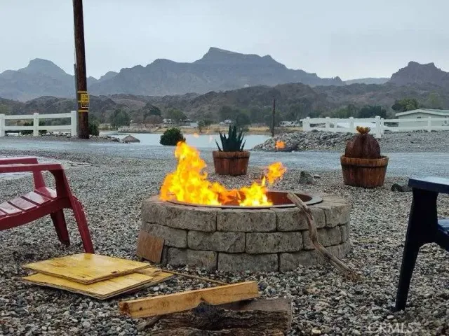 a view of a balcony with wooden floor and outdoor seating