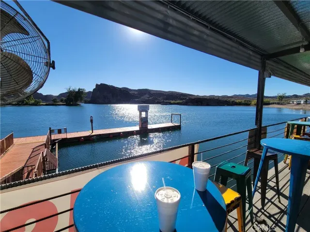 a view of a balcony with lake view and mountain view