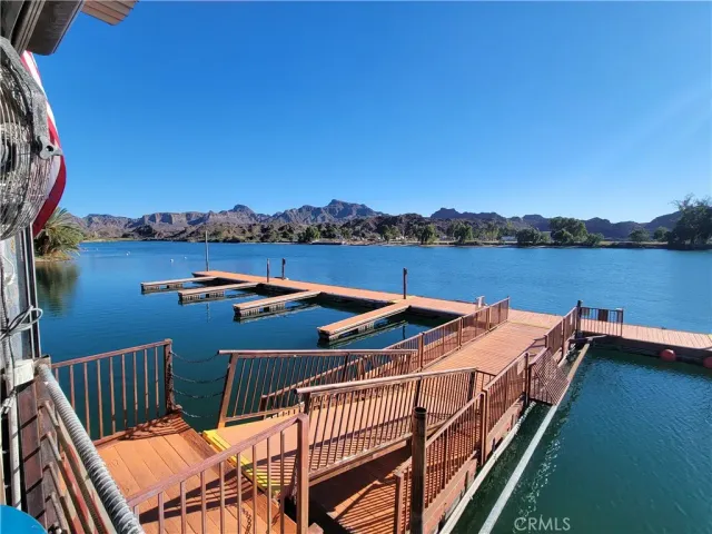 a view of a balcony with lake view and mountain view