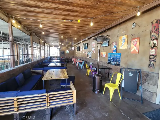 a balcony with wooden floor and outdoor space