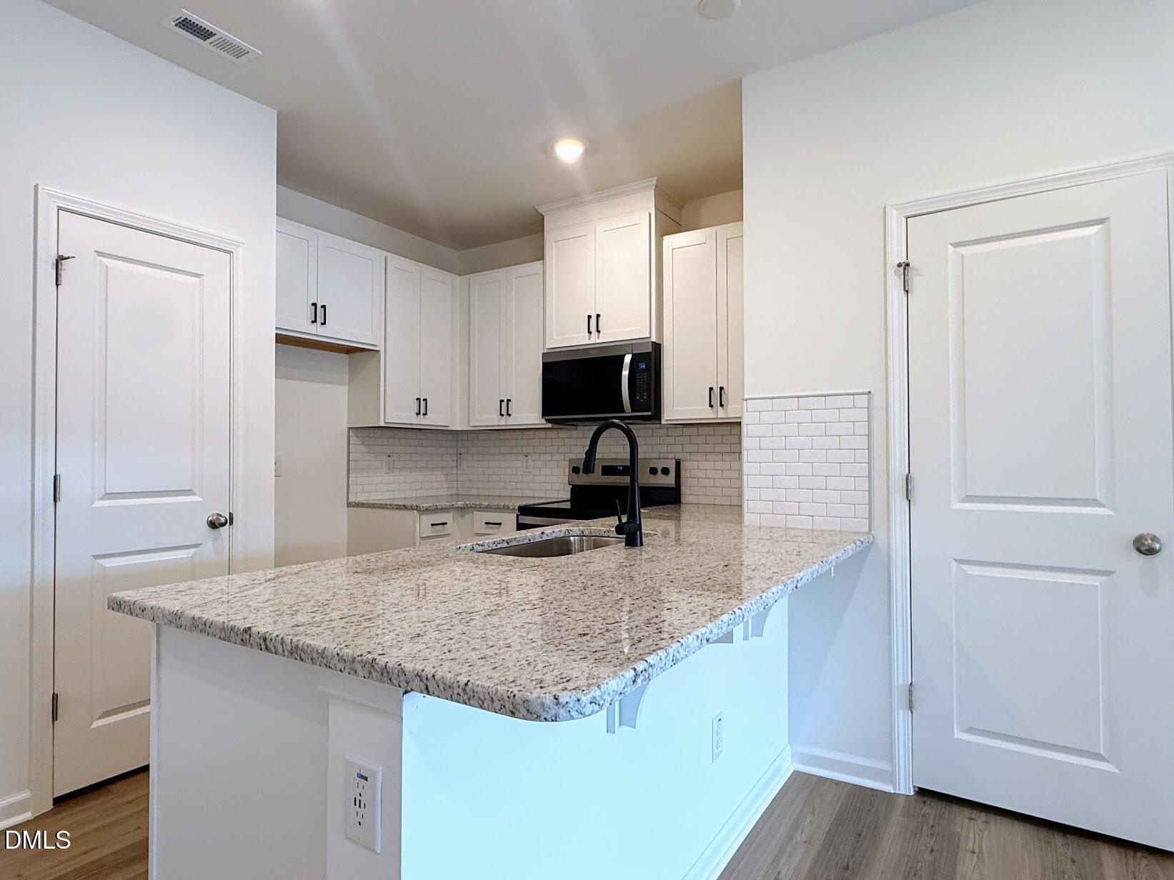 10606 Brookside Reserve Road Raleigh, NC 27614 - Photo 6 of 21 rr59 kitchen looking in