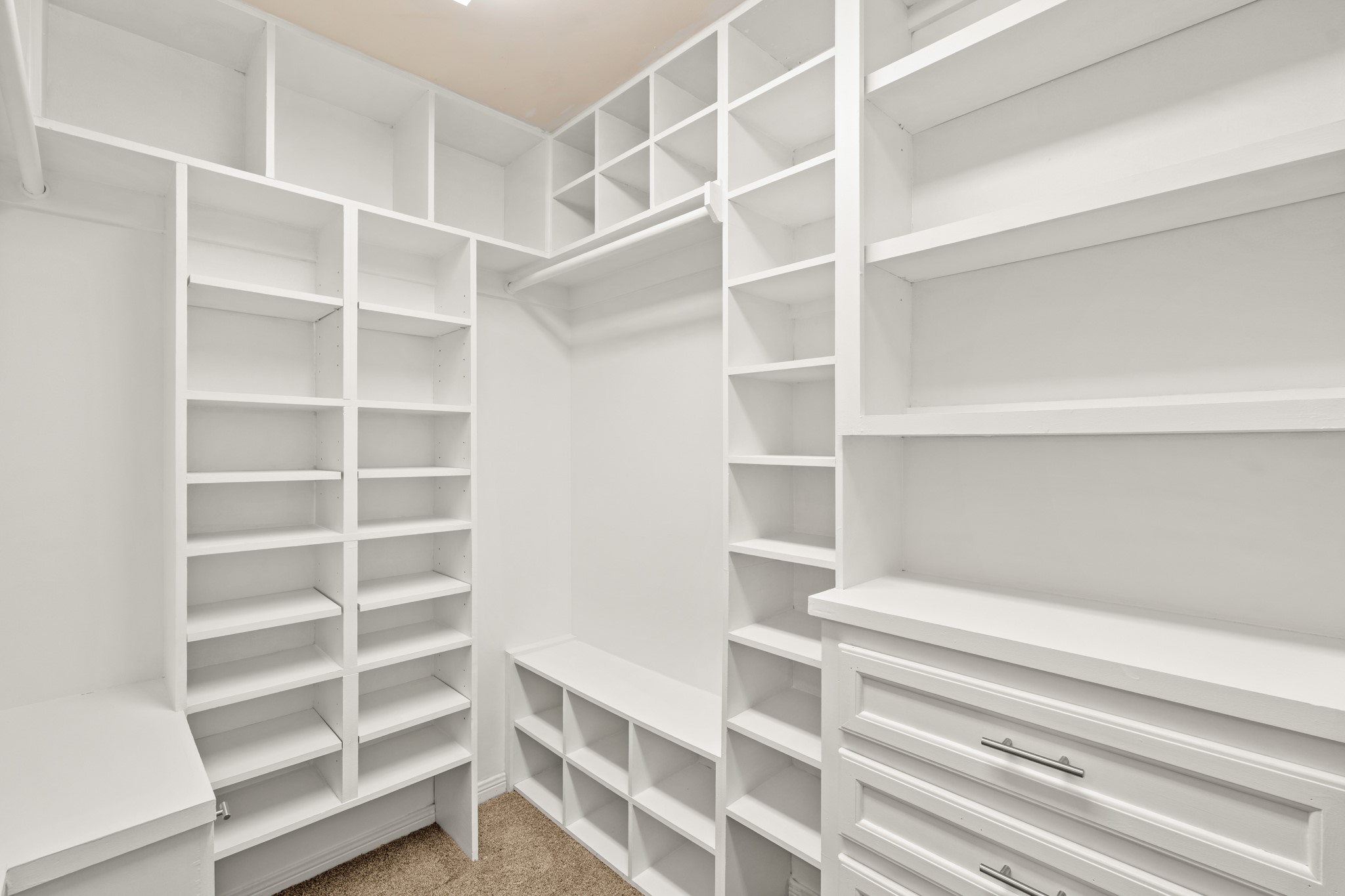 3525 Sage Road, Unit 1204 Houston, TX 77056 - Photo 21 of 25 Spacious walk-in closet with built-in shelving for organized storage.