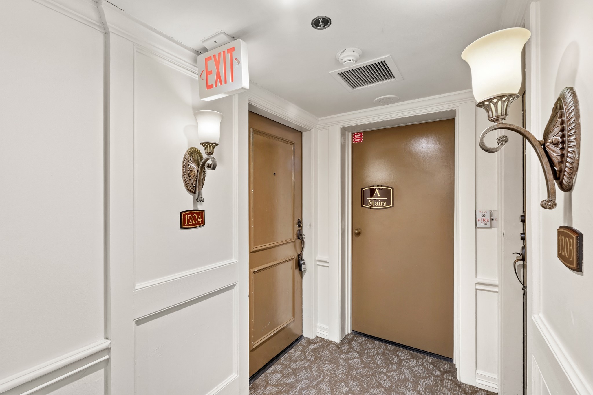 3525 Sage Road, Unit 1204 Houston, TX 77056 - Photo 7 of 25 Unit entry area with secure door access and hallway details.