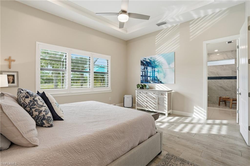 17210 Ashcomb Way Estero, FL 33928 - Photo 18 of 47 a bedroom with a large bed and a window
