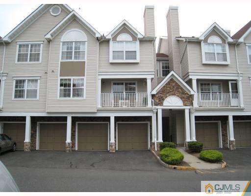 115 Inverness Drive Edison, NJ 08820 - Photo 1 of 10 a front view of a house with yard and parking