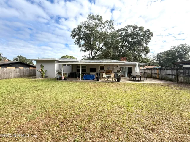 a view of a swimming pool and an outdoor space