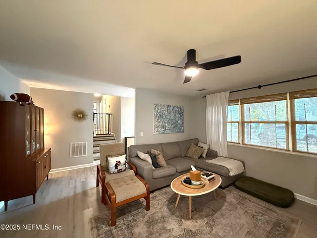 a living room with furniture and a window
