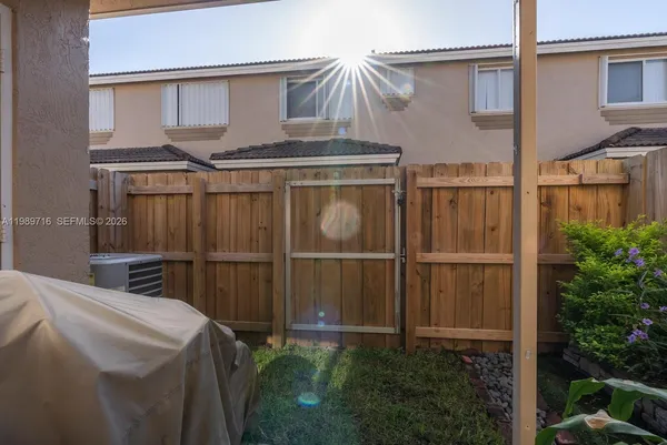 a view of a backyard with plants