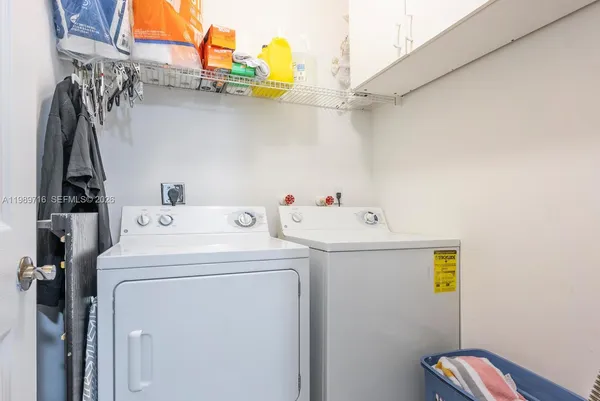 a utility room with dryer and washer