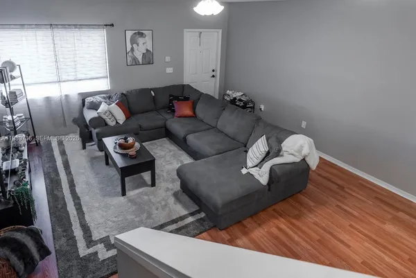 a living room with furniture and a window