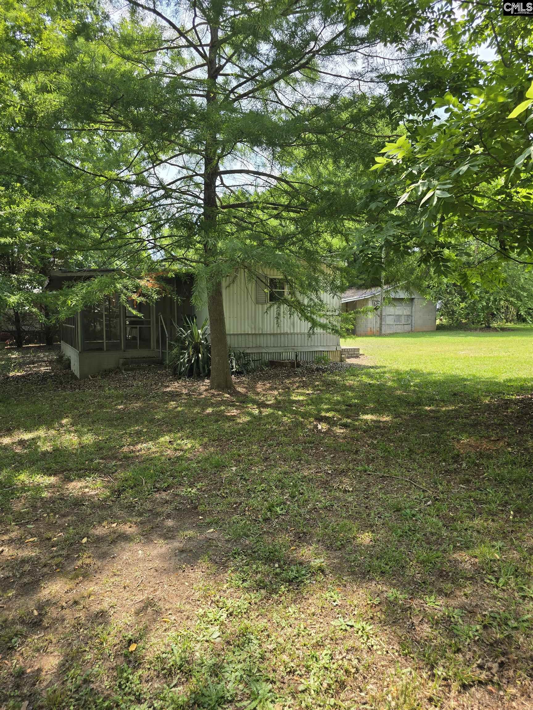 1193 Harvest Road Saluda, SC 29138 - Photo 7 of 9 a view of a yard with a tree