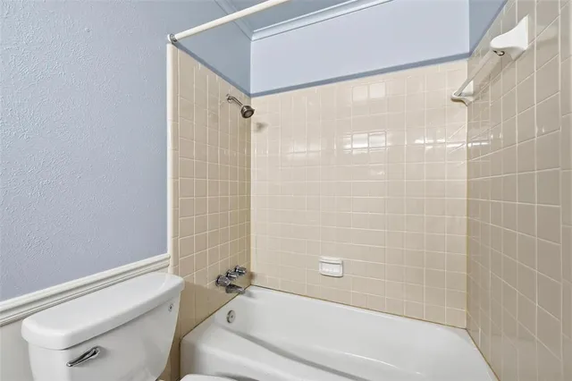 a bathroom with a shower and a bathtub