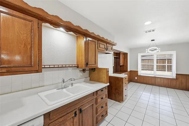 a bathroom with a sink a mirror and a bathtub