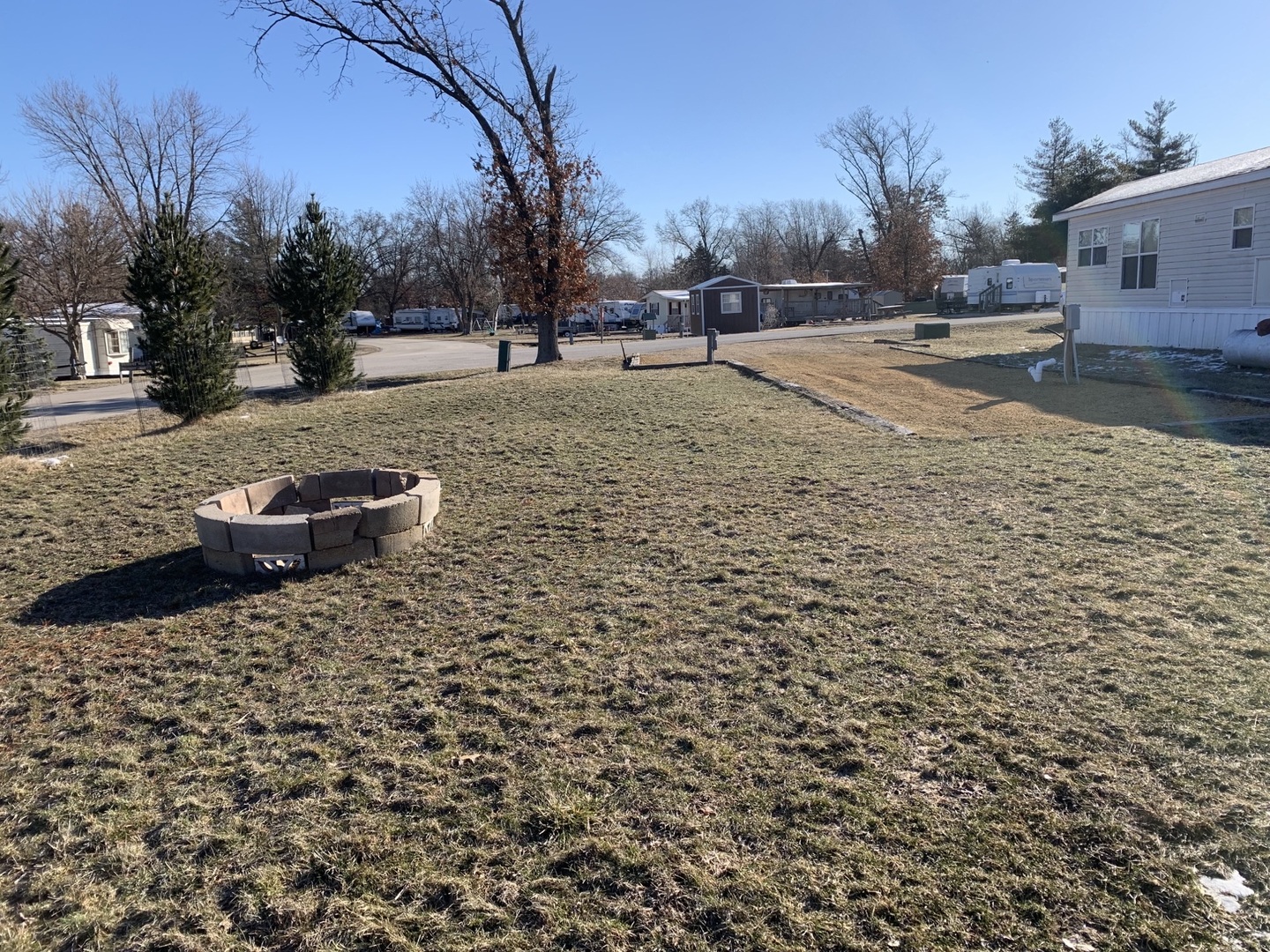 13-140 Woodhaven Sublette, IL 61367 - Photo 3 of 3 a street view with large trees